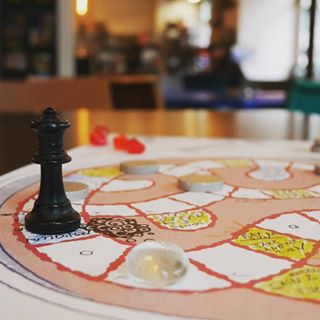 A snaddered game on the petri-dish board